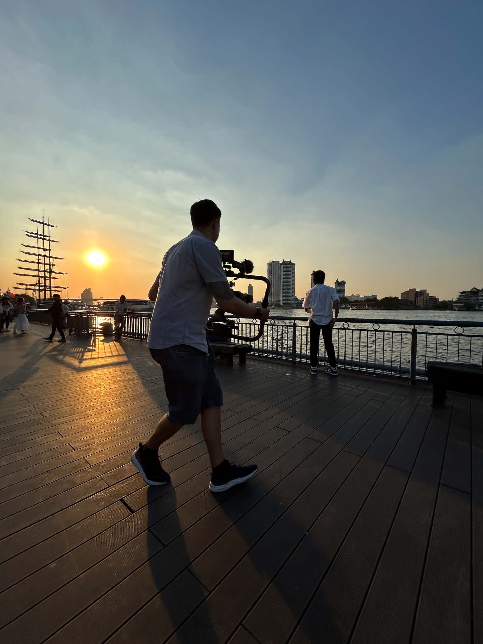 Filming at riverside sunset